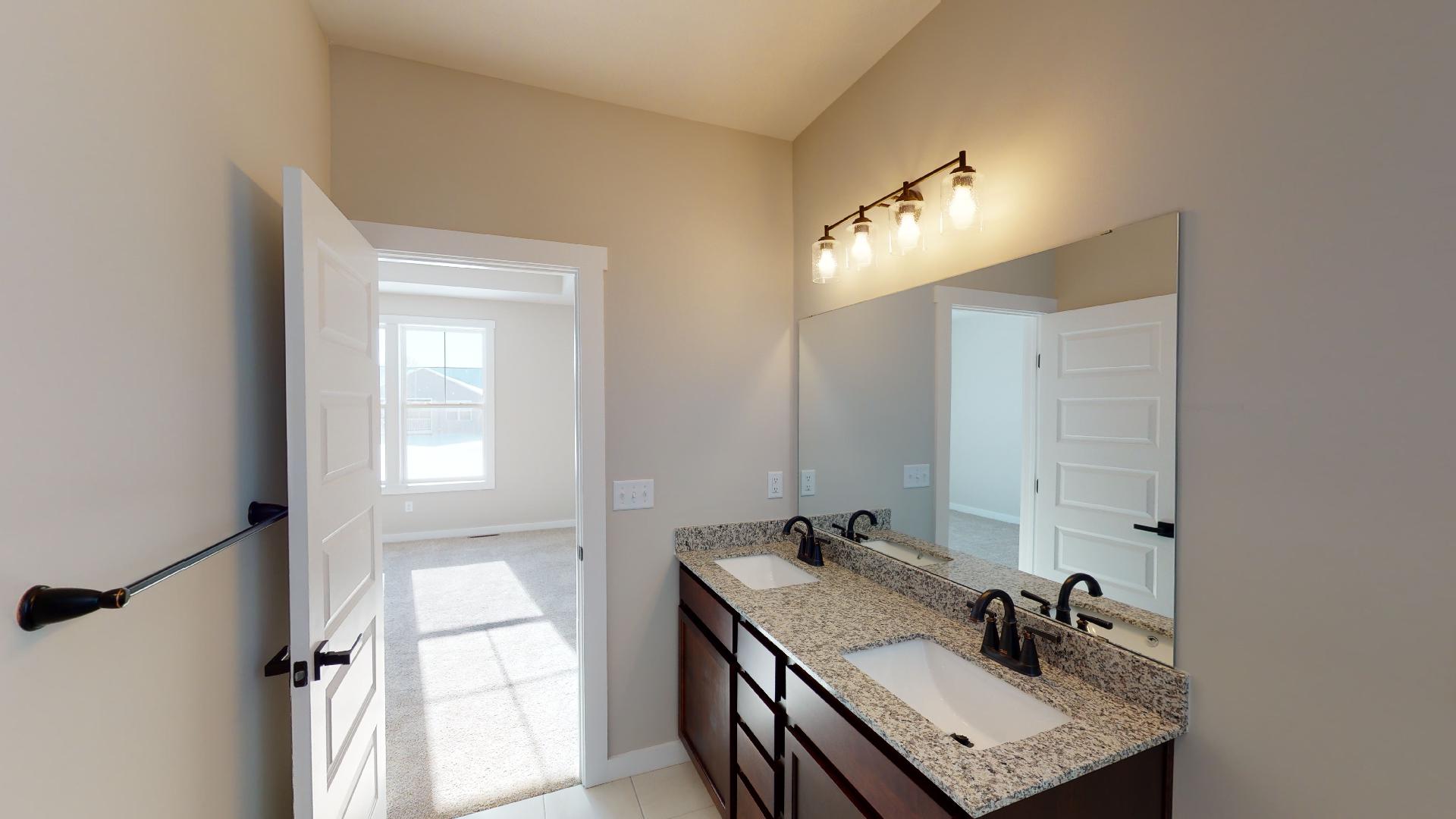 bathroom with double vanity