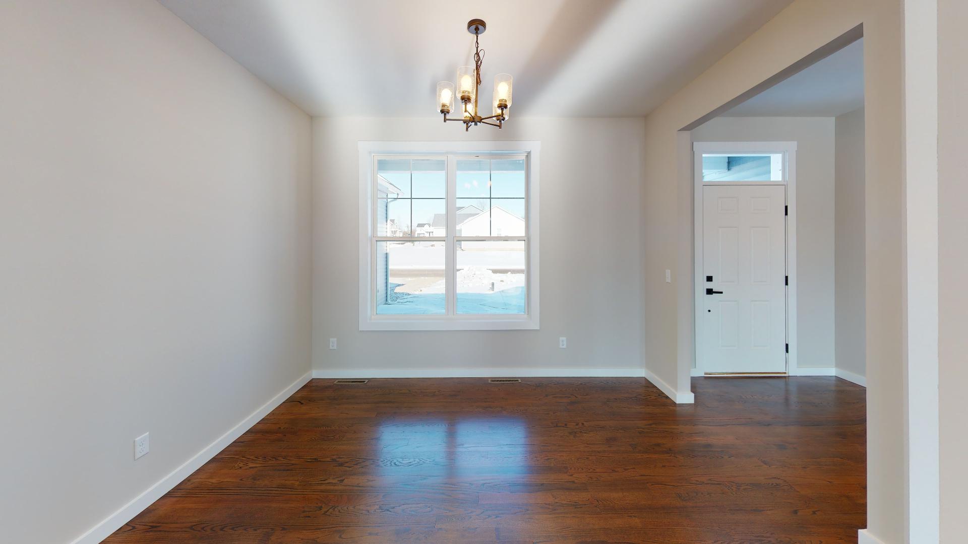 dining room to the left of the front door with window