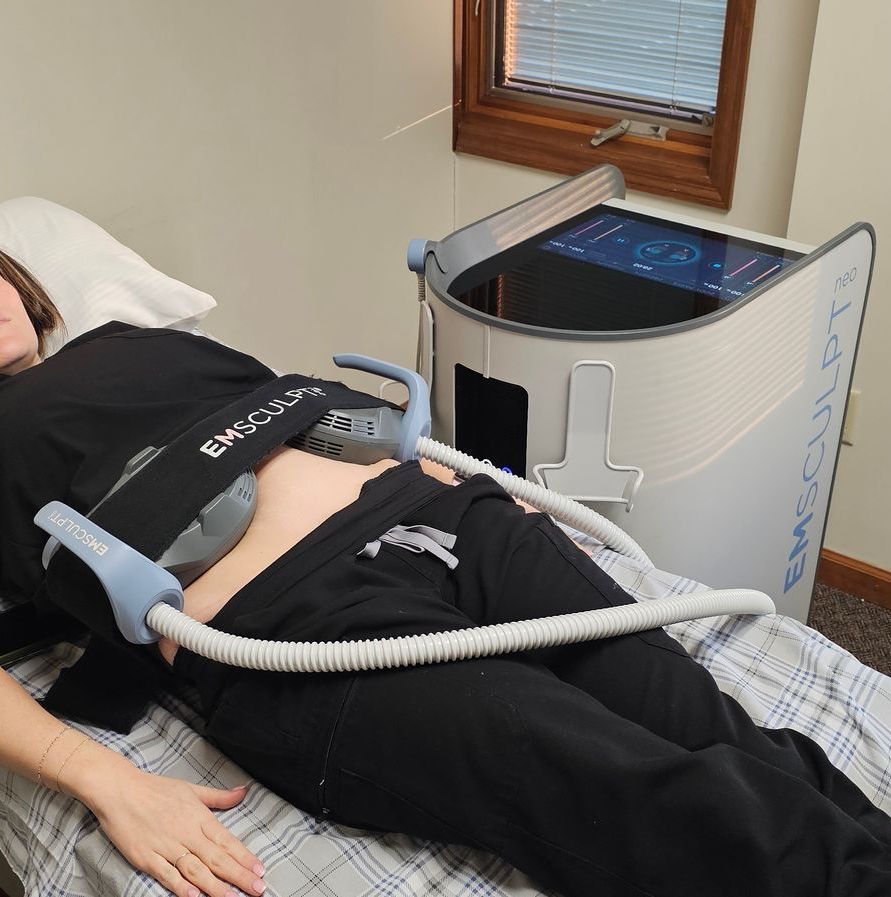 Emsculpt machine working on a patient