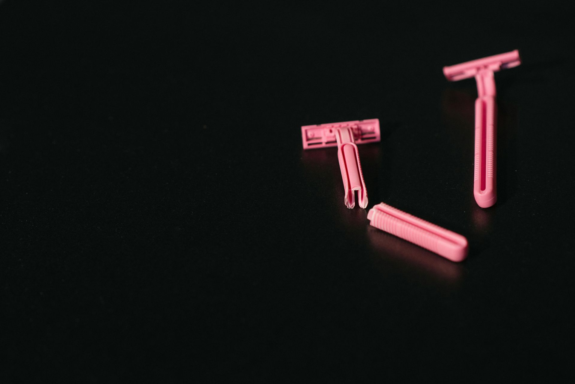 Traditional razors representing daily shaving routine that electrolysis eliminates permanently