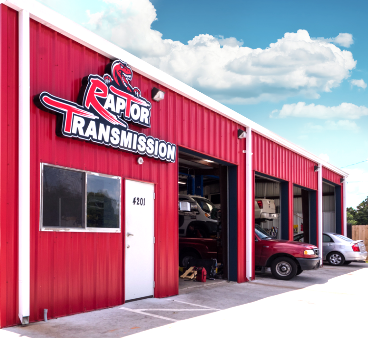 A red building with a sign that says raptor transmission