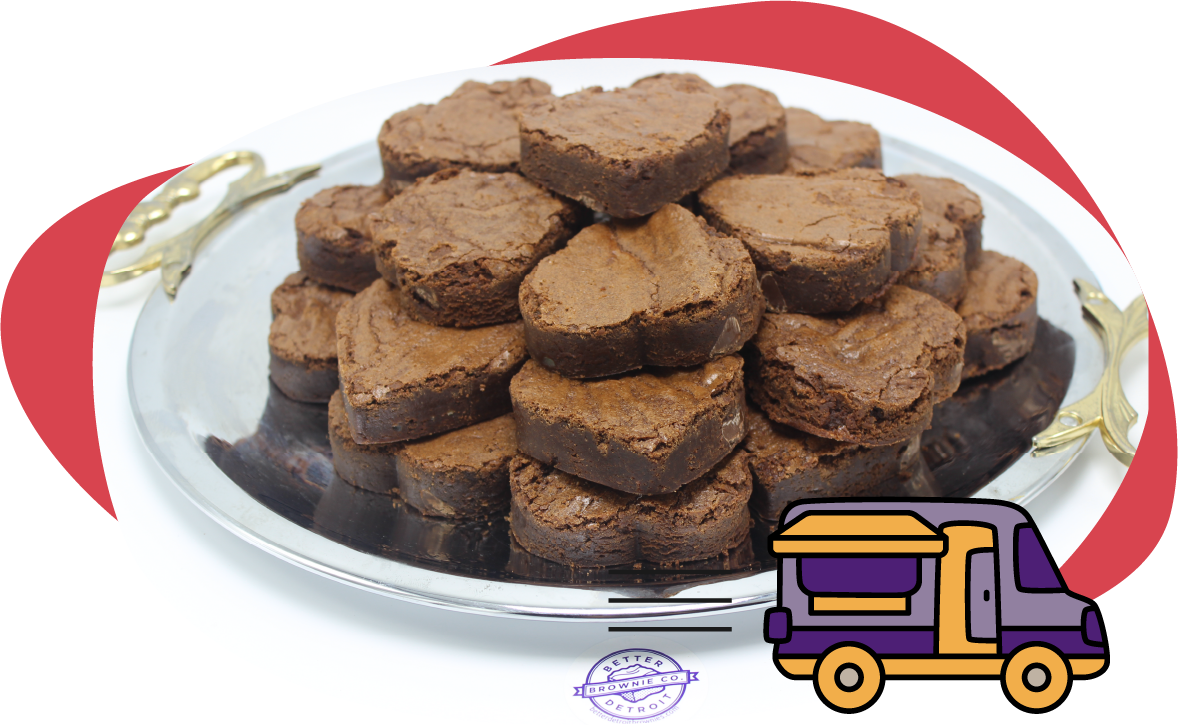 Heart-shaped brownies piled on a silver platter; delivery truck graphic.