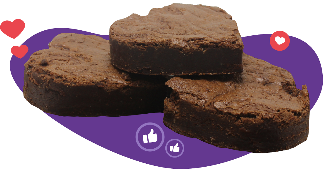 Heart-shaped brownies stacked on a purple shape, with hearts and thumbs up icons.