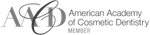 The american academy of cosmetic dentistry logo is black and white.