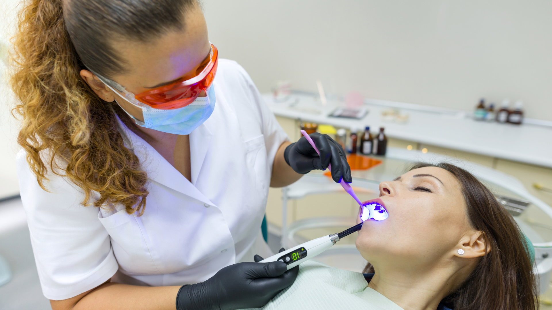 a computer generated image of a All on 4 dental implnats with a blue background .