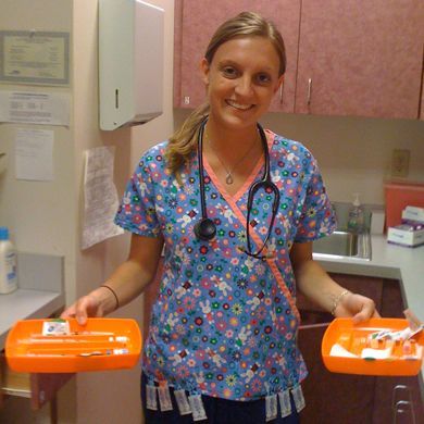 Nurse holding immunization trays