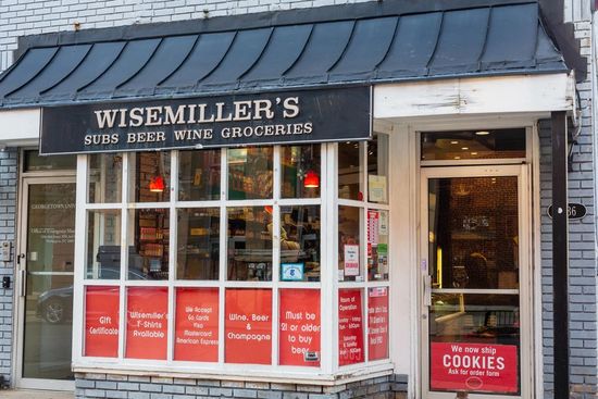 The front of a store called wise miller 's wine groceries