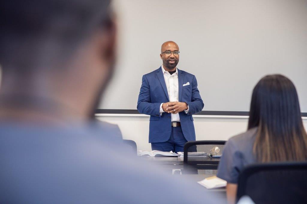 Dr. Bain speaking to students | dental assistant program school in Villa Rica GA