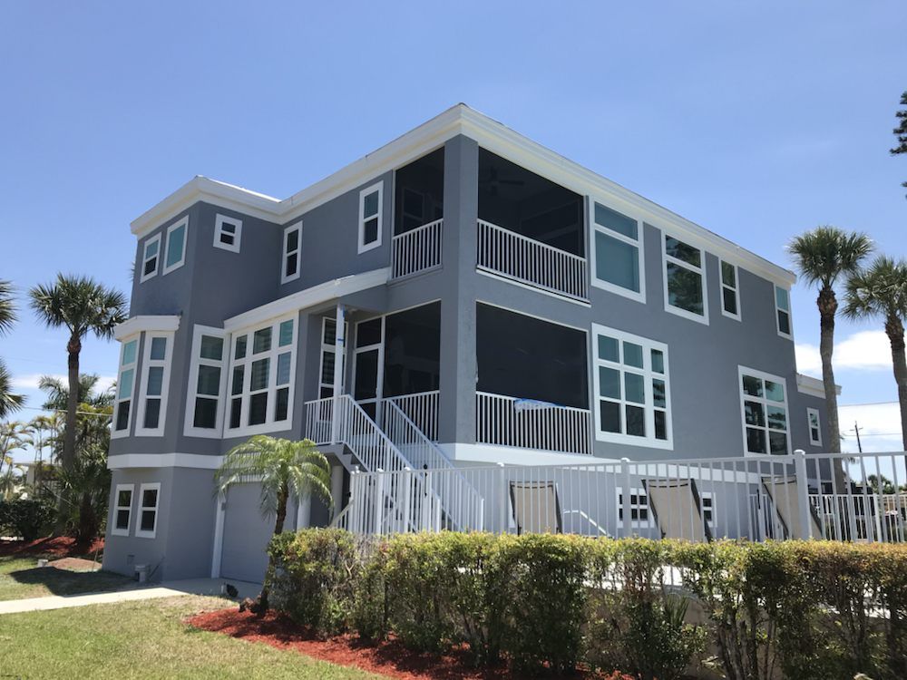 A large house with a lot of windows and balconies