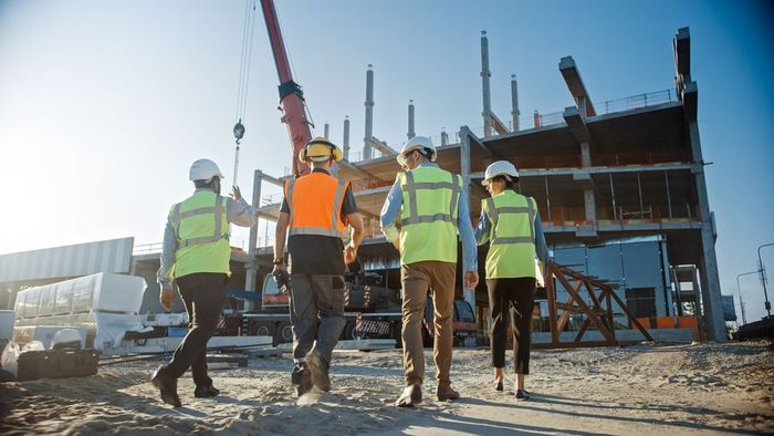 Steel building specialists working on industrial construction