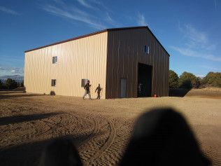 Industrial steel building contractors working on factory construction