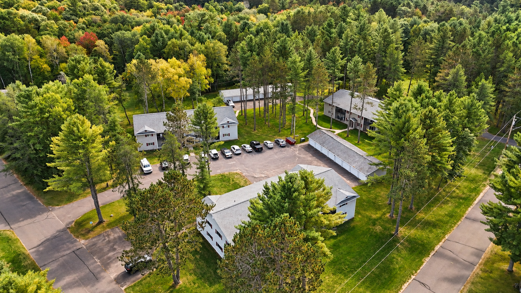 Welcome to Balsam Woods Apartments, a well-maintained, professionally managed community located in the heart of Woodruff, WI. The property consists of three two-story buildings nestled on beautifully kept grounds with expansive green space. Each spacious two-bedroom apartment is designed for comfort, featuring functional layouts and private outdoor space—ground-level units offer patios while second-floor units include private balconies. With detached garages available, on-site storage, and professional management, Balsam Woods offers a quiet and convenient residential setting perfect for enjoying the Northwoods.