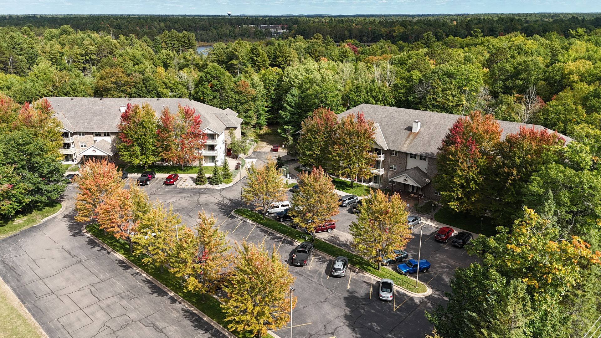 Welcome to Island Estates Apartments, a premier 72-unit community located off Old Hwy 70 in the scenic town of Minocqua, WI. Our two three-story buildings offer a quiet, well-kept living environment with modern conveniences designed for comfort. Residents enjoy spacious layouts including one-bedroom, one-bedroom plus den, and two-bedroom options, all featuring in-unit laundry, in-floor hydronic heat, and air conditioning. With heated underground parking, central elevators, and Spectrum TV & internet included in your rent, Island Estates provides an elevated Northwoods lifestyle. Professionally managed by Ritchie’s Management Group, this community combines high-quality construction with the peaceful atmosphere of the 