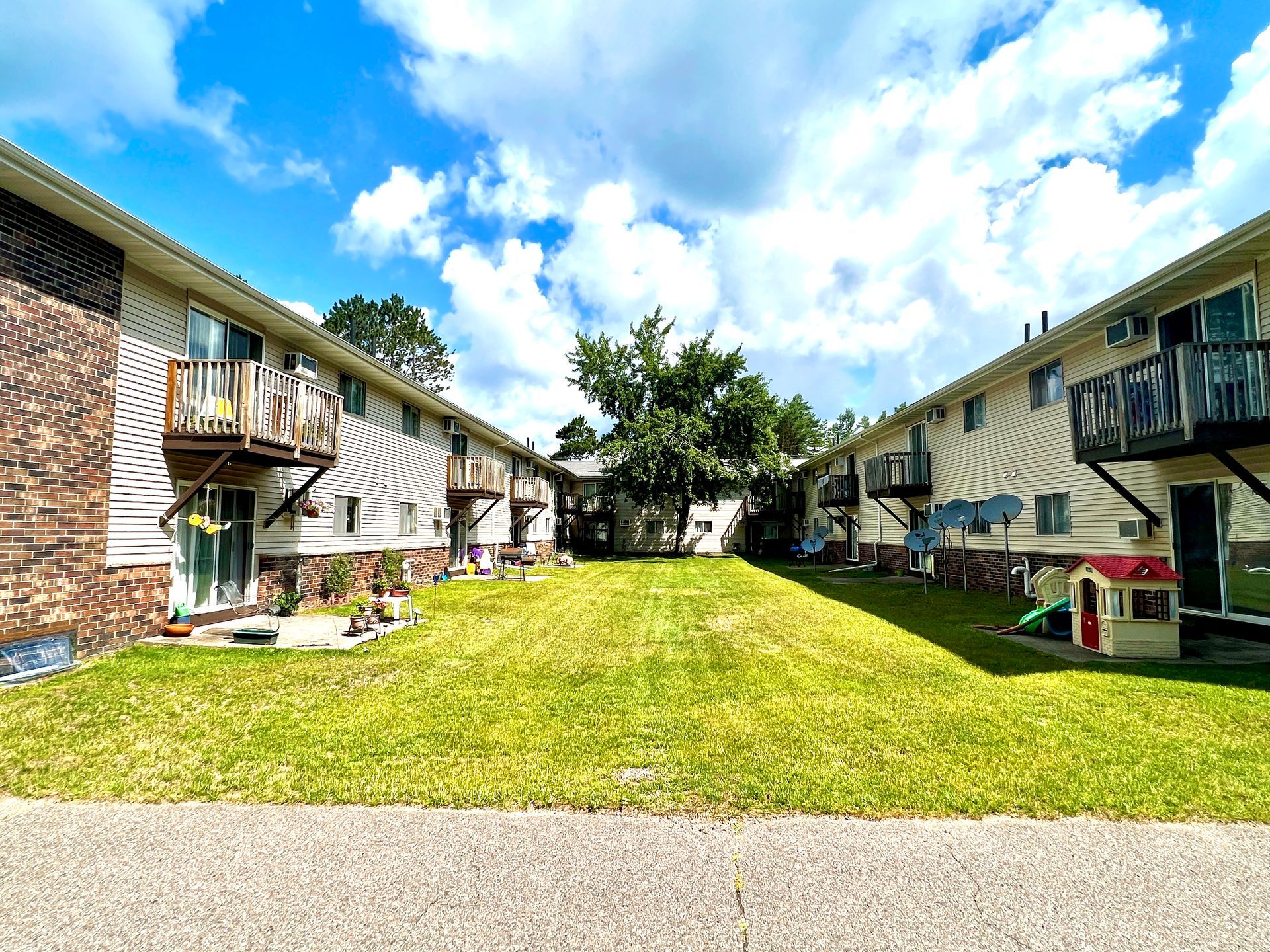 Welcome to Edgewood Apartments, a well-maintained 20-unit community conveniently located in Minocqua, WI. Offering a comfortable and practical residential setting, each two-bedroom apartment features a functional layout with approximately 850 square feet of living space. Residents enjoy private outdoor spaces, with ground-floor units offering patios and second-floor units featuring private balconies. Located just off County Highway J, the property provides easy access to the heart of the