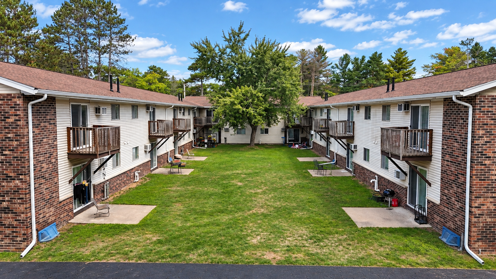 Welcome to Edgewood Apartments, a well-maintained 20-unit community conveniently located in Minocqua, WI. Offering a comfortable and practical residential setting, each two-bedroom apartment features a functional layout with approximately 850 square feet of living space. Residents enjoy private outdoor spaces, with ground-floor units offering patios and second-floor units featuring private balconies. Located just off County Highway J, the property provides easy access to the heart of the