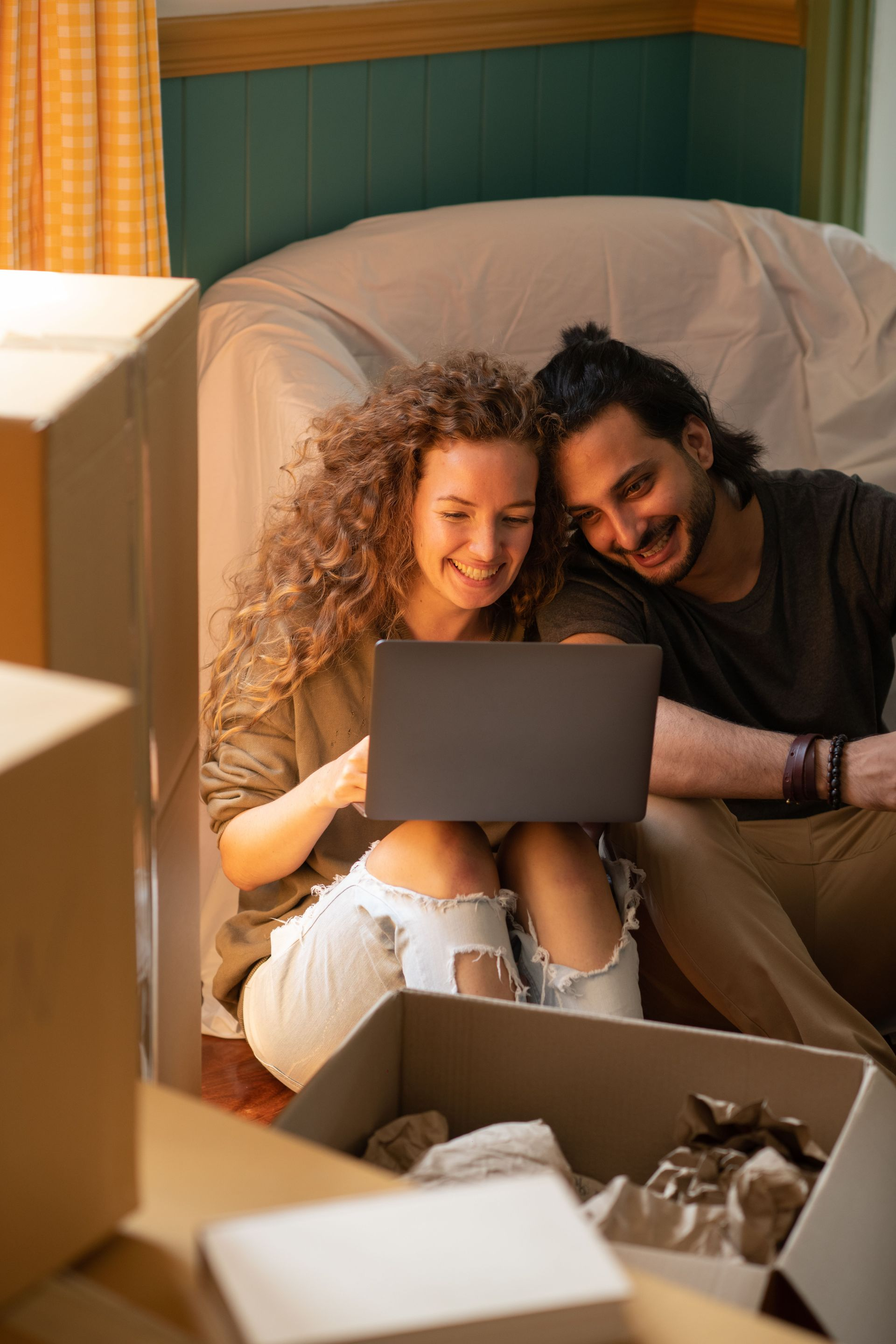 A couple using the online property management software to sign their lease and make their rent payment.