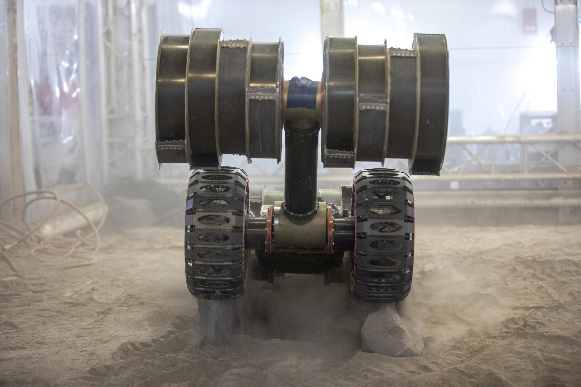 NASA's ISRU Pilot Excavator under test in a lunar regolith bin at Kennedy Space Center