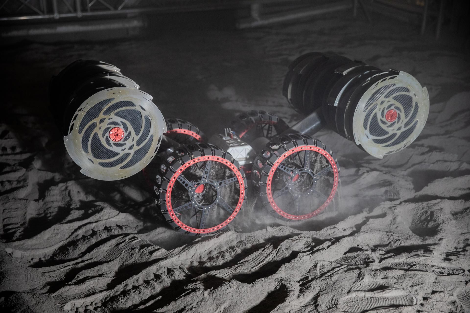 The ISRU Pilot Excavator digging regolith with the lights out during a test run