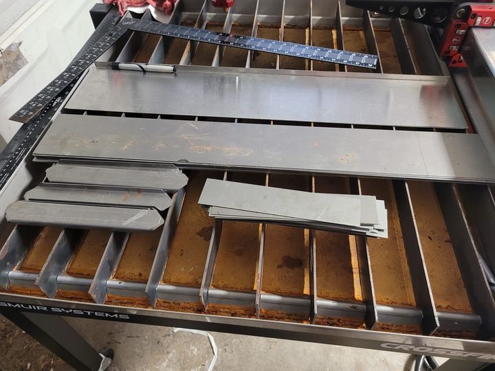 Sheet steel cut and laid out on the press brake in the Hephaestus shop