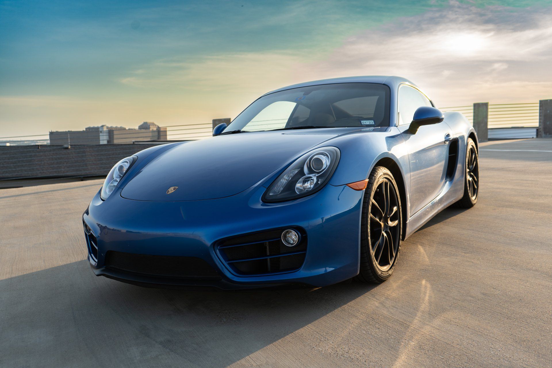 Cars are often seen as symbols of status and power, but the electric blue Porsche Cayman is a refreshingly different take on luxury. This cheerful shade of blue is eye-catching and unique, making it a standout choice for anyone who wants to add a touch of personality to their ride. And while electric blue may not be everyone's cup of tea, it's certainly a color that will turn heads when driving down the street. So if you're looking to make a statement with your car, the electric blue Porsche Cayman is the perfect way to do it.