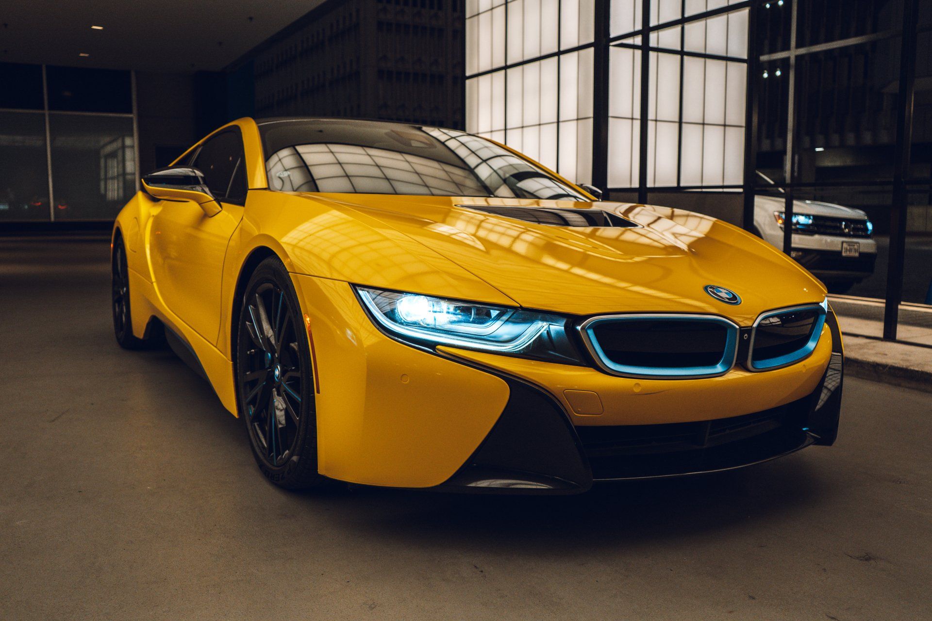 The BMW i8 is one of the coolest cars on the road today. With its yellow wrap and sleek design, it's sure to turn heads wherever it goes. But the i8 isn't just a pretty face - it's also a great performer. Thanks to its hybrid engine, the i8 can go from 0 to 60 in just 4.4 seconds. And with a top speed of 155 mph, it's sure to get your heart racing. Whether you're looking for style or speed, the BMW i8 is the perfect car for you.
