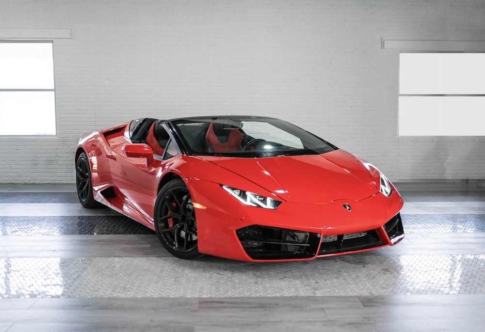 The Lamborghini Huracan Spider is a work of art on wheels. With its sleek design and powerful engine, this vehicle is sure to turn heads wherever it goes. The 5.2-liter V10 engine produces an impressive 602 horsepower, allowing the Huracan Spider to go from 0 to 60 mph in just 2.9 seconds. And with a top speed of 202 mph, this vehicle is sure to get you where you're going in style. Enjoy the ride of a lifetime with the Lamborghini Huracan Spider.