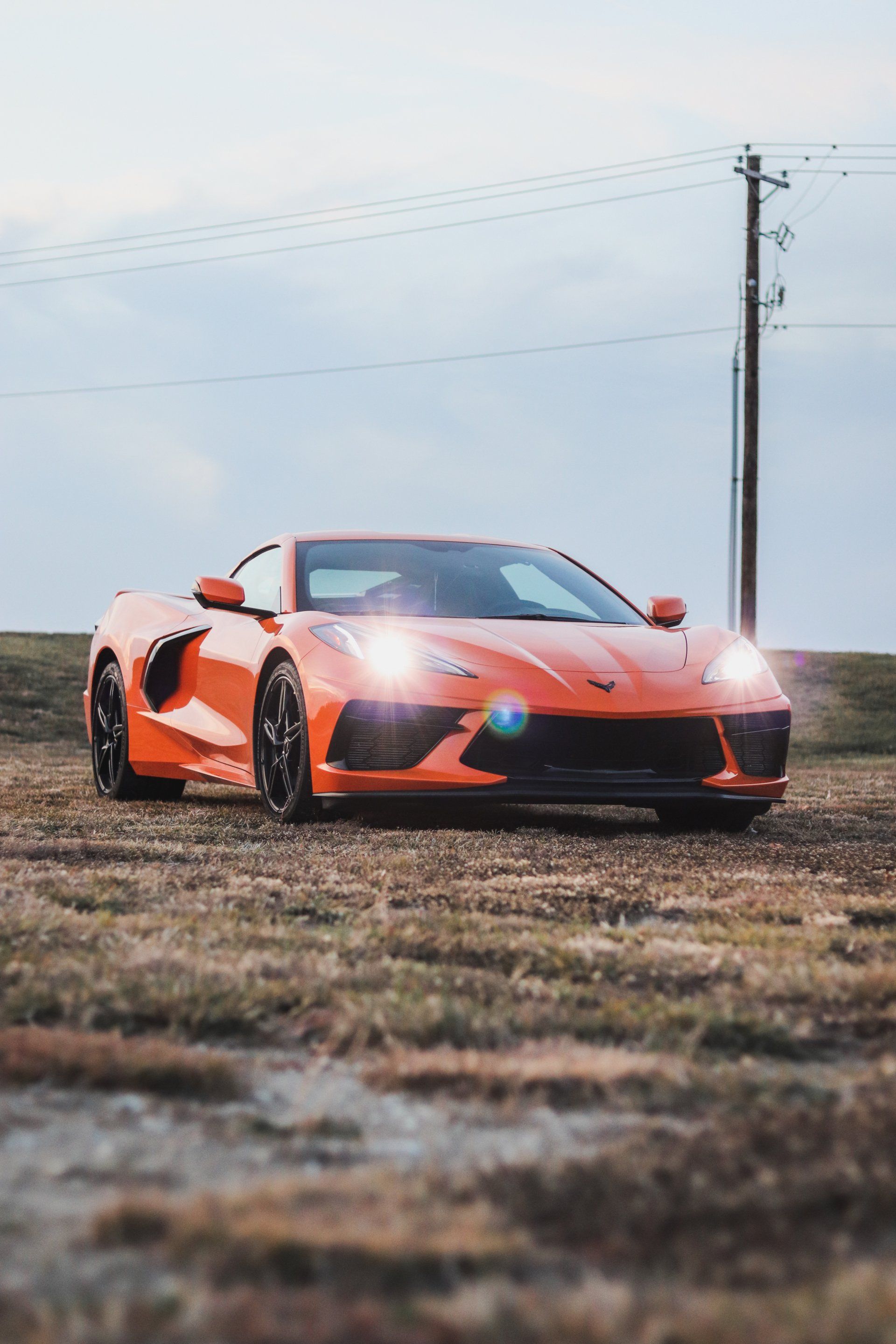 The Corvette C8 Stingray is the first mid-engine Corvette and it is absolutely fierce. It's available in an eye-catching orange color that is sure to turn heads when driving. The C8 also has a sleek and modern design that is sure to appeal to car enthusiasts. In addition, the C8 has a powerful engine that is capable of reaching speeds of up to 200 miles per hour. The Corvette C8 Stingray is a truly impressive car and is sure to be a favorite among car enthusiasts for years to come.