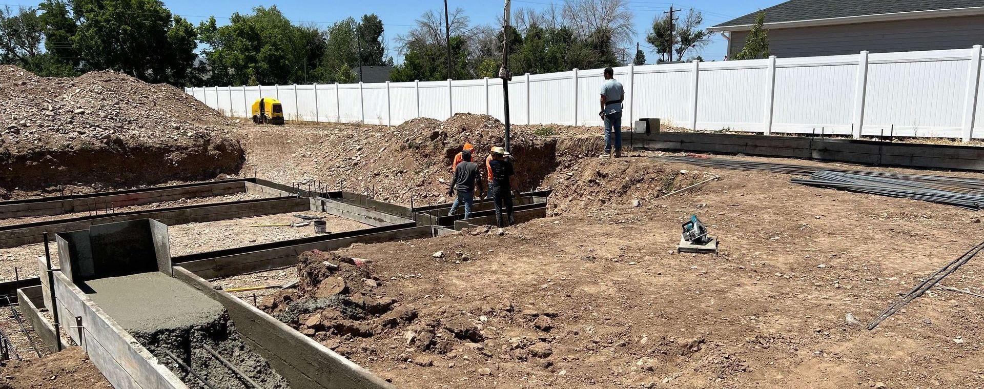 A group of construction workers are working on a construction site in Beaver Utah