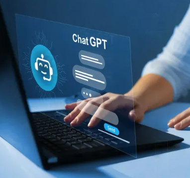 A person is typing on a laptop with chat gpt on the screen