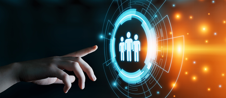 A person is pressing a button with a group of people in a circle.