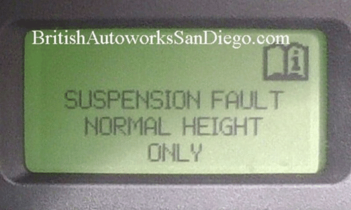Green dashboard display reading “SUSPENSION FAULT NORMAL HEIGHT ONLY.”