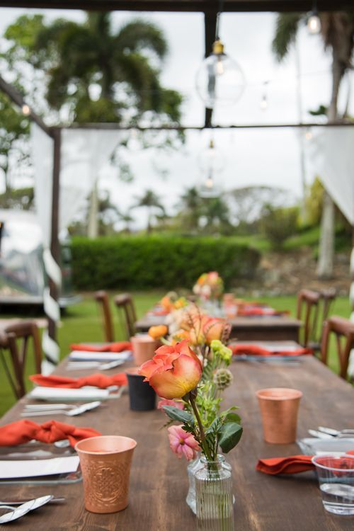 A Wooden Table With A Vase Of Flowers On It - Honolulu, HI - Bella Rosa Corporation