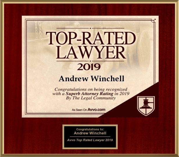 Top Rated Lawyer 2019 plaque honoring Andrew Winchell on a red background