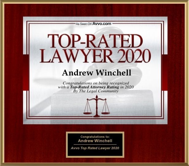 Framed red award plaque for Andrew Winchell, Top-Rated Lawyer 2020, with scales of justice