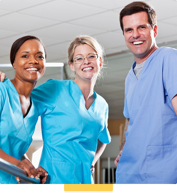 Two nurses and a man are posing for a picture together