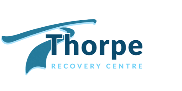 The logo for thorpe recovery centre is blue and black