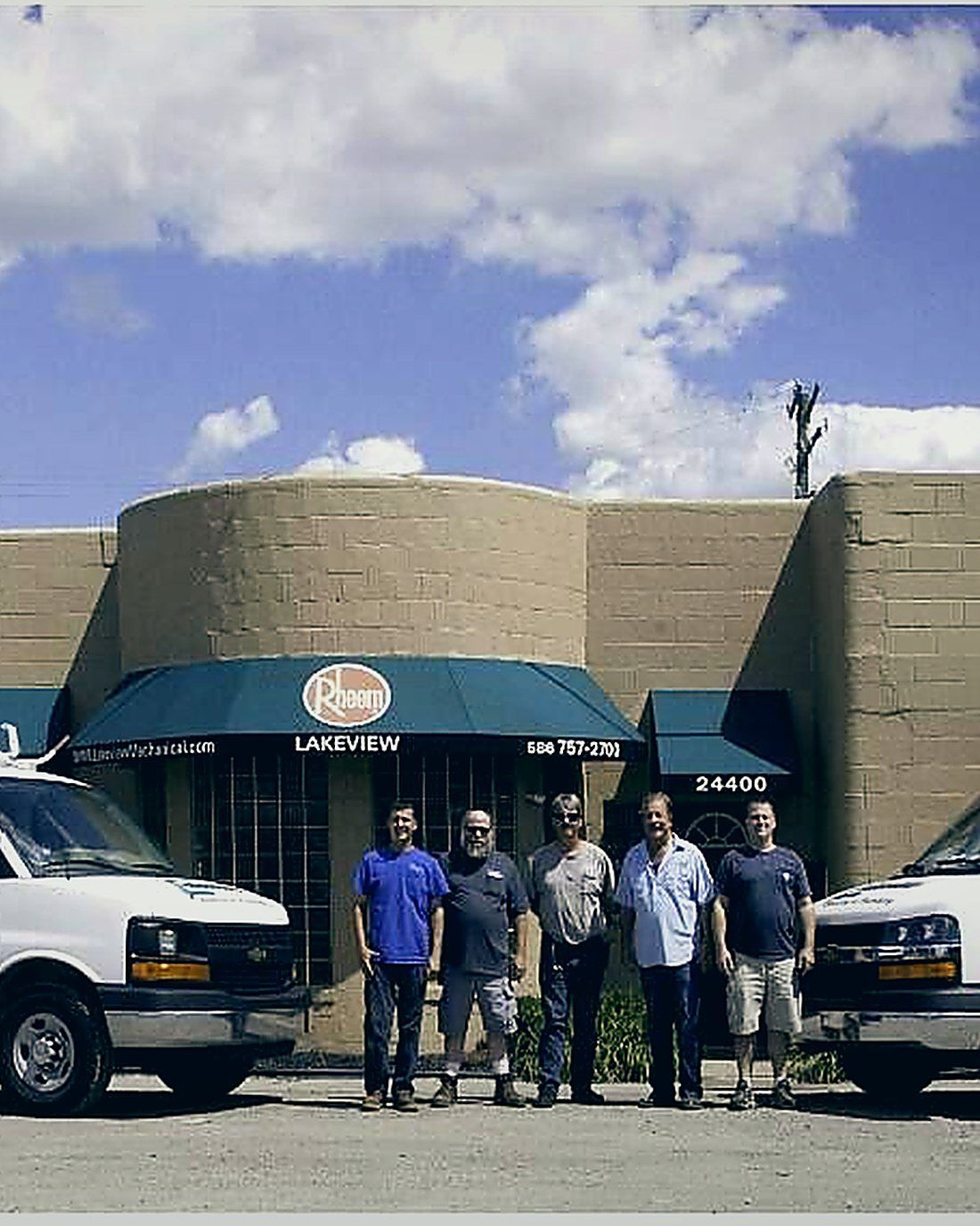 The Lakeview Plumbing, Heating, Cooling & Electrical crew and service vans outside the shop on Mound Road in Warren, MI