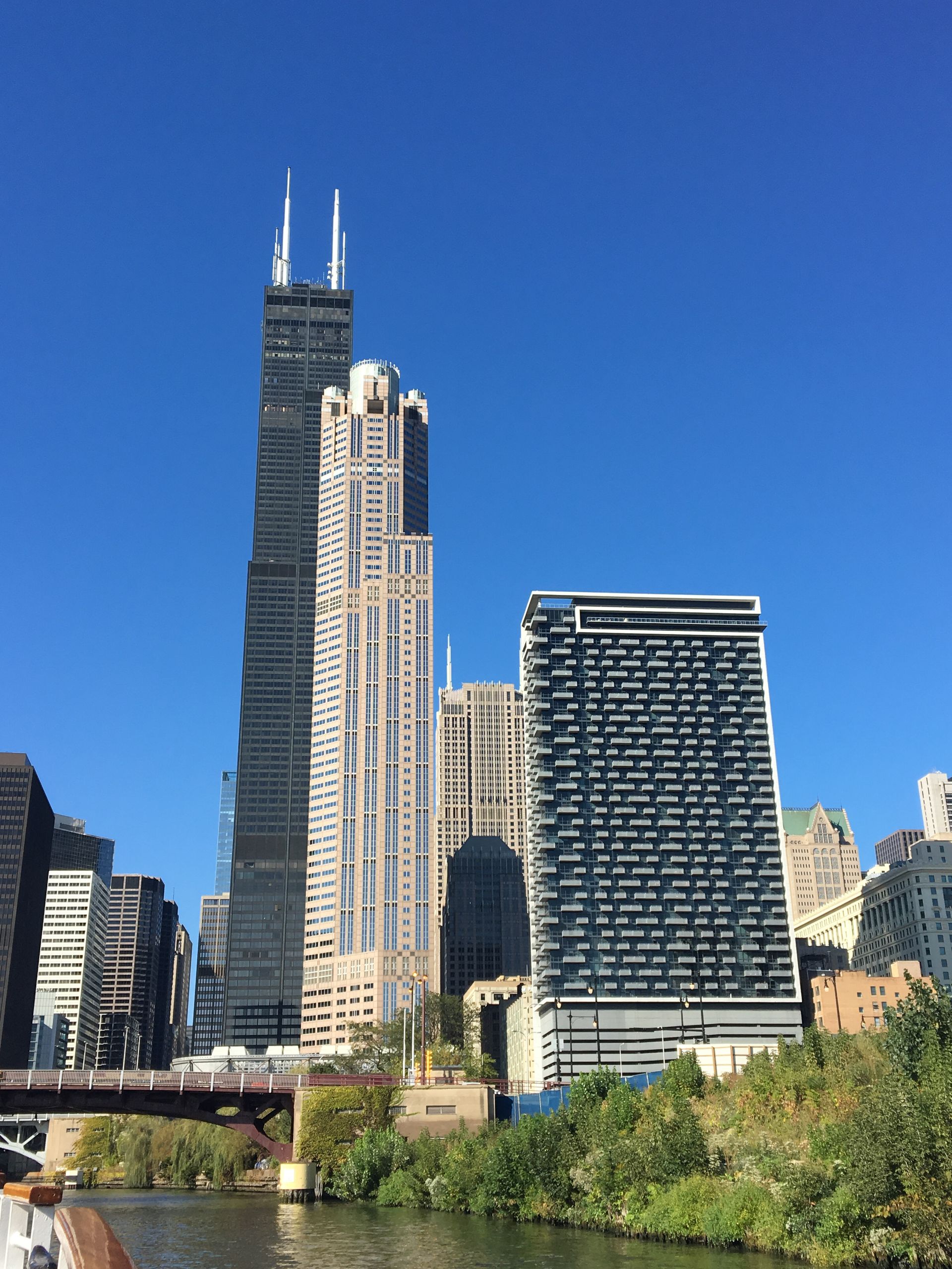Chicago skyline with the Willis Tower and riverfront under a clear blue sky