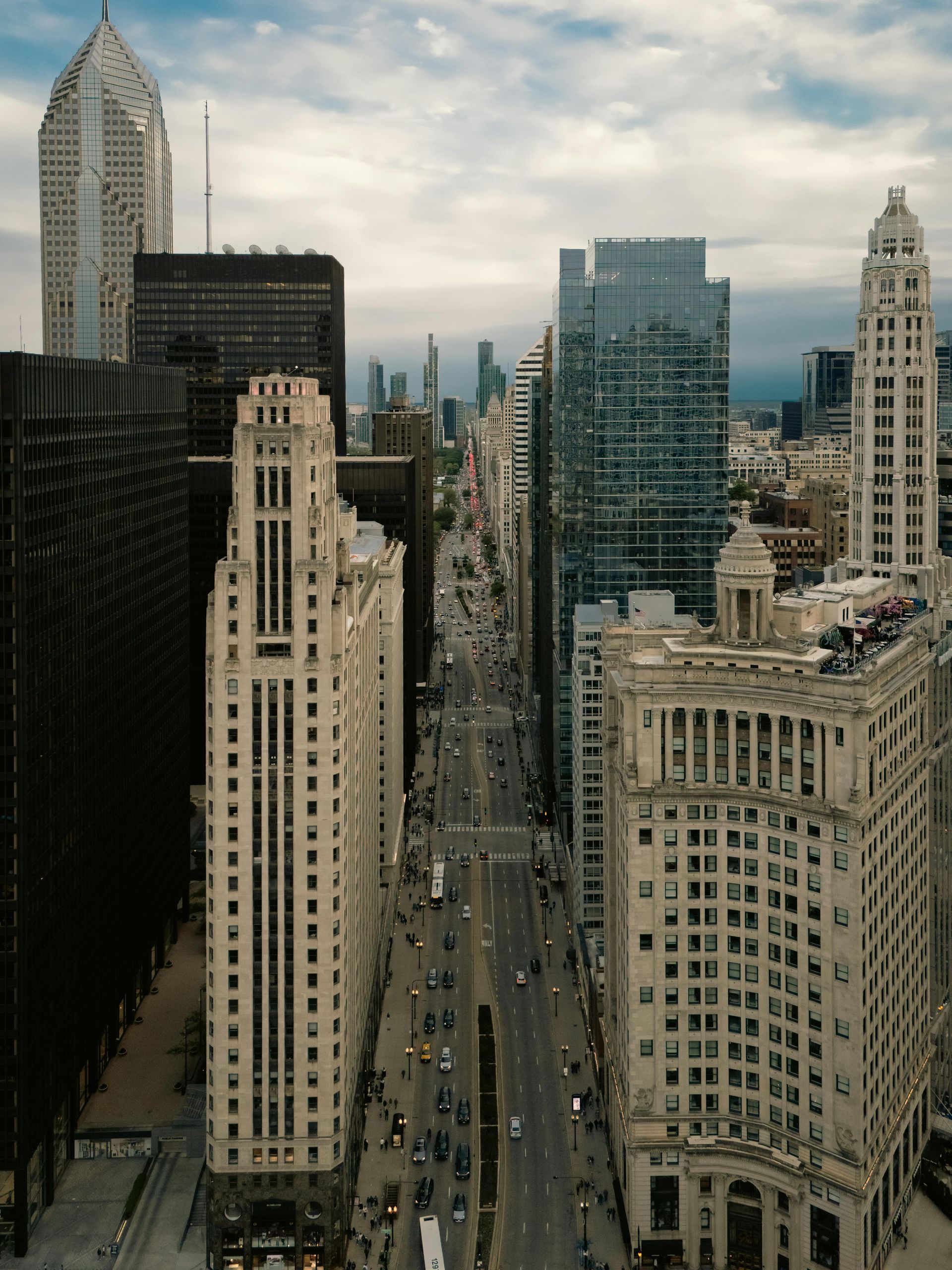 Downtown city skyline with tall buildings and a busy street viewed from above