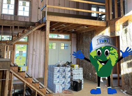 A cartoon character is standing in a house under construction.