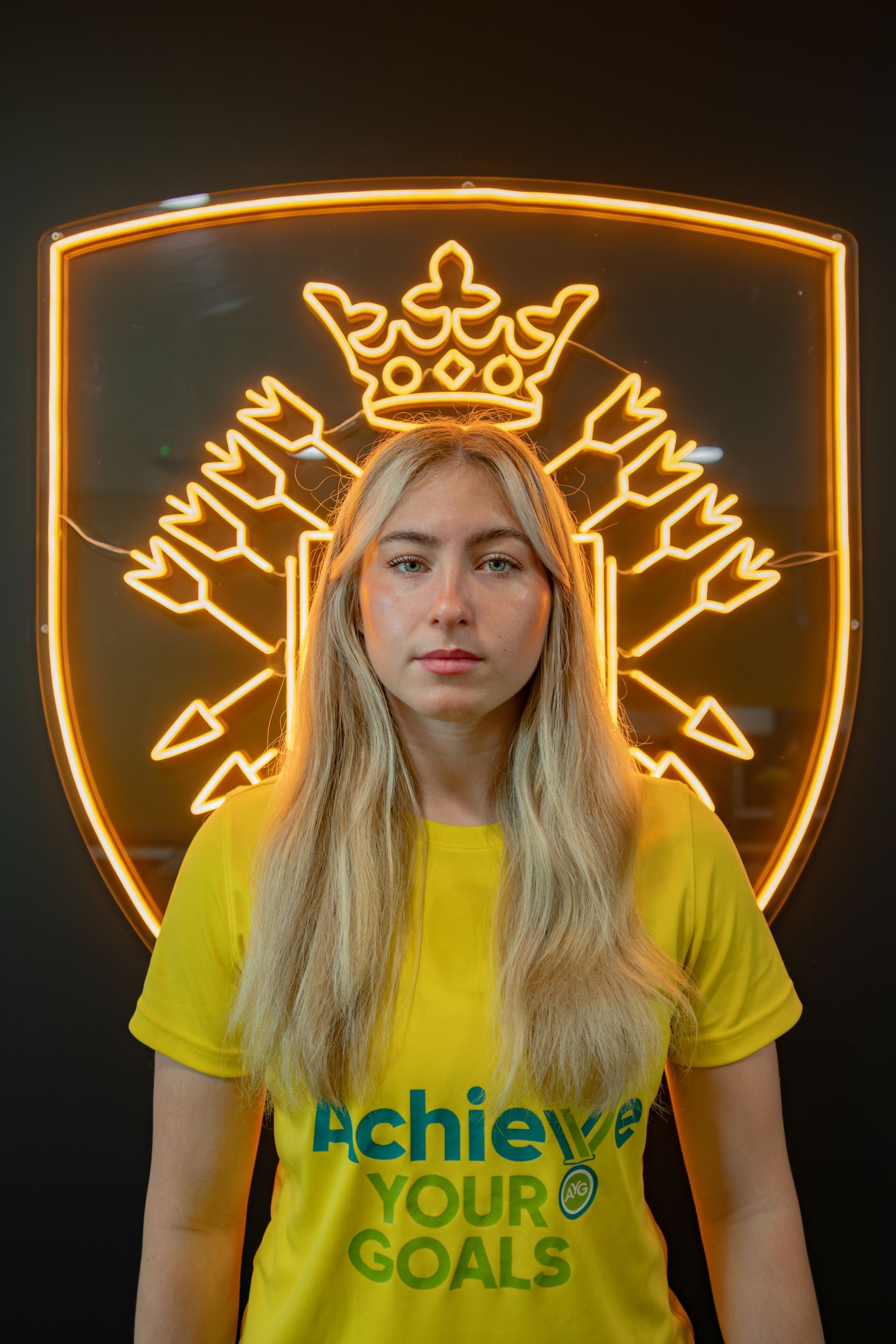 Blonde woman in yellow shirt with 