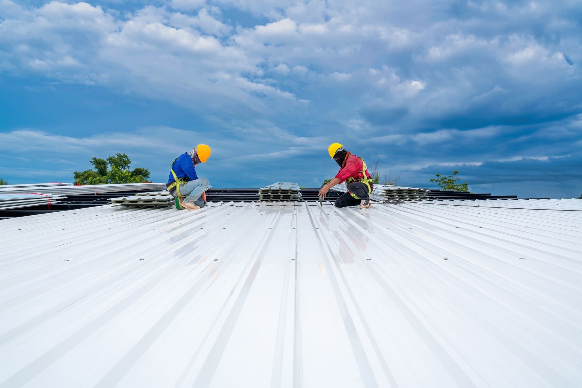 Roof Maintenance Technicians on Commercial Roofing Surface