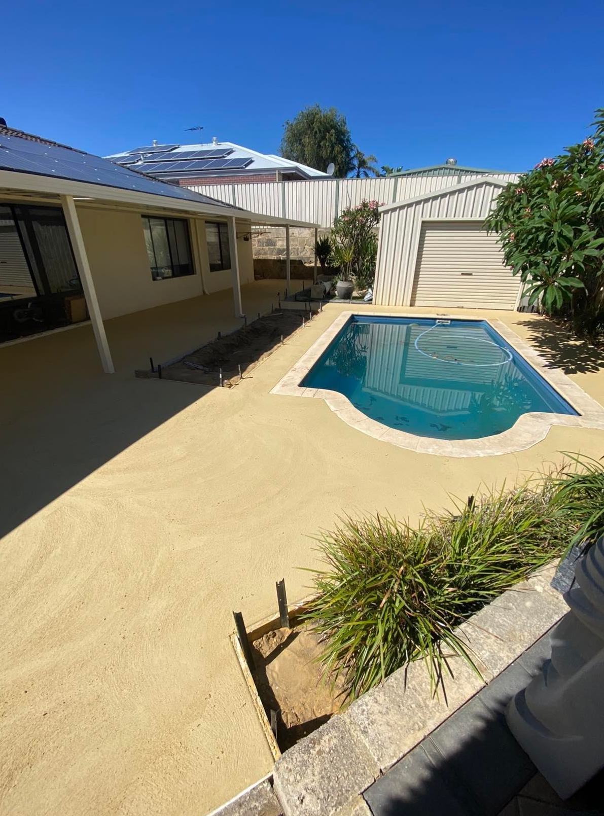 Liquid Limestone around pool area and under patio in back yard of the house