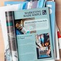 Marketing brochure with laptop and business photos, titled “Marketing Made Simple”