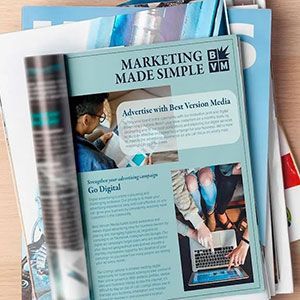 Marketing brochure with laptop and business photos, titled “Marketing Made Simple”