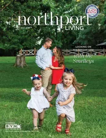Northport Living cover with a family in a grassy yard, featuring two young girls and a man in white and red.
