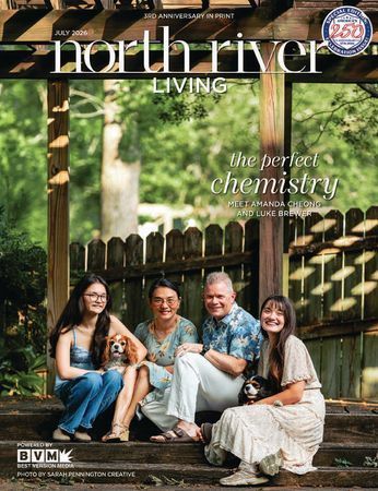 Couple standing on a grassy lawn with North River Living magazine text overlay.