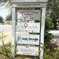 Sign listing businesses at 1305 Greensboro Avenue, including Jemison-Van de Graaff Mansion and Palmera Collective