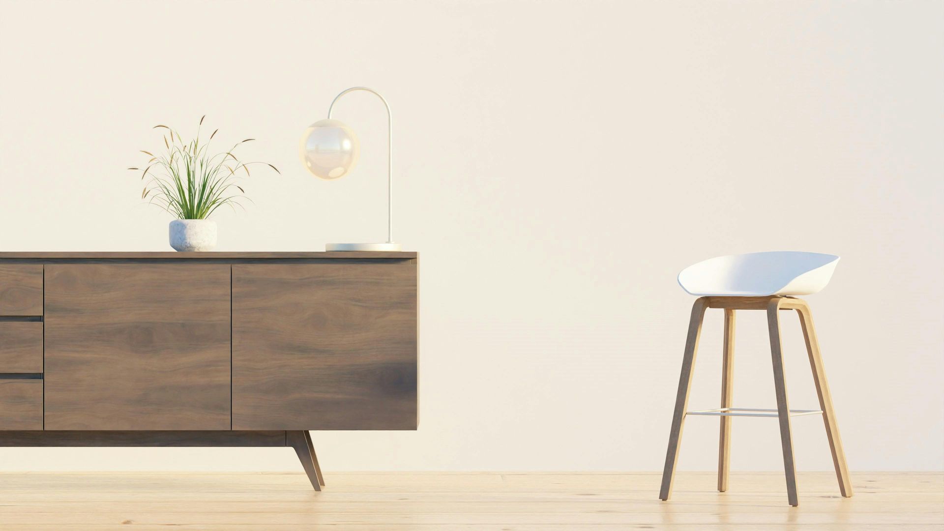 Habitación minimalista con aparador de madera, planta en maceta, lámpara y taburete blanco sobre un suelo claro.