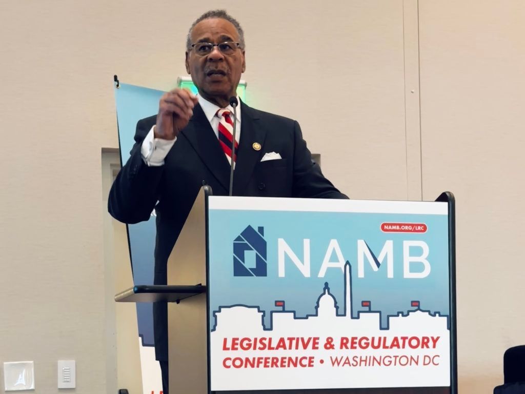 Speaker at NAMB legislative and regulatory conference podium, gesturing while speaking.